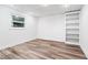 Finished basement area featuring laminate flooring, a window and recessed lighting at 3355 Old Peachtree Rd, Dacula, GA 30019