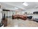 Basement featuring a leather sectional sofa, exercise equipment, and neutral decor at 3355 Old Peachtree Rd, Dacula, GA 30019