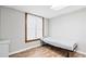 Bedroom featuring wood-look flooring, natural light from window, and neutral decor at 3355 Old Peachtree Rd, Dacula, GA 30019