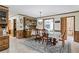 Dining room with tile floors, a china hutch, and a glass top table that seats six at 3355 Old Peachtree Rd, Dacula, GA 30019