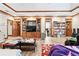 Spacious living room featuring wood-look floors, wood trim, and built-in shelving at 3355 Old Peachtree Rd, Dacula, GA 30019