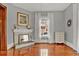 Bright bedroom features original hardwood floors, a fireplace, and neutral paint for a serene setting at 561 Culberson Sw St, Atlanta, GA 30310