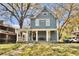 Beautiful two-story home with a welcoming front porch, classic design, and well maintained front yard at 561 Culberson Sw St, Atlanta, GA 30310
