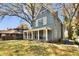 Charming two-story home with a large front porch and a well-maintained lawn and beautiful mature trees at 561 Culberson Sw St, Atlanta, GA 30310