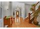 Inviting foyer with hardwood floors, a grand staircase, and a charming wood accent table at 561 Culberson Sw St, Atlanta, GA 30310