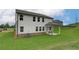 A well-maintained backyard with a covered patio and expansive green space, perfect for outdoor activities at 1797 Kingsmere Run Dr, Loganville, GA 30052