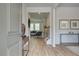Inviting foyer with hardwood floors, stylish decor, and a view into the spacious living area at 1797 Kingsmere Run Dr, Loganville, GA 30052