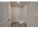 Small laundry room with a floor drain and wire shelving at 1797 Kingsmere Run Dr, Loganville, GA 30052