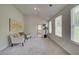 Bright and spacious main bedroom with sitting area and view to the ensuite bath at 1797 Kingsmere Run Dr, Loganville, GA 30052