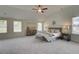 Spacious main bedroom with many windows and a neutral color palette at 1797 Kingsmere Run Dr, Loganville, GA 30052