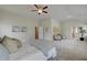 Spacious main bedroom with sitting area and view to the ensuite bath at 1797 Kingsmere Run Dr, Loganville, GA 30052