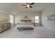 Spacious main bedroom with neutral decor, ample windows, and a ceiling fan at 1797 Kingsmere Run Dr, Loganville, GA 30052