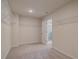 Large carpeted walk-in closet with wire shelving and access to the Primary bathroom at 1797 Kingsmere Run Dr, Loganville, GA 30052