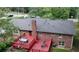 An aerial view showcasing the home's exterior and spacious red deck at 2202 Springdale Dr, Snellville, GA 30078