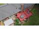 Aerial view of the backyard with a red deck featuring dining and lounge seating at 2202 Springdale Dr, Snellville, GA 30078