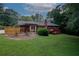 Exterior view showing the deck, patio area and landscaped backyard at 2202 Springdale Dr, Snellville, GA 30078