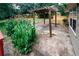 Backyard featuring a pergola with a walkway surrounded by garden plants at 2202 Springdale Dr, Snellville, GA 30078