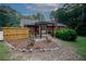 This home has a big backyard, a pergola, beautiful flowers and a fence at 2202 Springdale Dr, Snellville, GA 30078