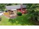 Backyard featuring the deck, patio with covering and landscaping at 2202 Springdale Dr, Snellville, GA 30078