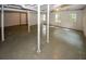 Unfinished basement with white ceiling, gray floor, and support beams at 2202 Springdale Dr, Snellville, GA 30078
