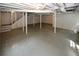 Open basement space with painted support columns and concrete floor at 2202 Springdale Dr, Snellville, GA 30078