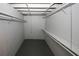Basement storage area with painted concrete walls and overhead shelving at 2202 Springdale Dr, Snellville, GA 30078