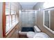 Bathroom featuring tiled walk-in shower and natural light at 2202 Springdale Dr, Snellville, GA 30078