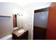 Bathroom features vanity with granite countertop and decorative mirror at 2202 Springdale Dr, Snellville, GA 30078