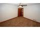 Bedroom with carpet, ceiling fan, and a view into an adjoining room at 2202 Springdale Dr, Snellville, GA 30078