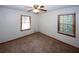 Bedroom with two windows providing ample natural light, and a ceiling fan at 2202 Springdale Dr, Snellville, GA 30078
