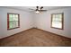 Bedroom with two windows providing ample natural light, and a ceiling fan at 2202 Springdale Dr, Snellville, GA 30078