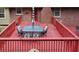 A close up on the beautiful red deck with outdoor furniture, perfect for entertaining at 2202 Springdale Dr, Snellville, GA 30078