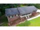 Overhead view of the brick house highlights the roof, landscaping, and outdoor space at 2202 Springdale Dr, Snellville, GA 30078