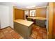 Quaint kitchen featuring terracotta floors, butcher block counters, and retro design at 2202 Springdale Dr, Snellville, GA 30078