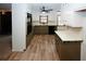 Well-lit kitchen with plentiful countertop space, wood-look floors, and stylish built-in appliances at 2202 Springdale Dr, Snellville, GA 30078