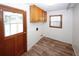 Well-lit laundry room features ample storage and access to the outdoors at 2202 Springdale Dr, Snellville, GA 30078