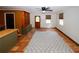 Large living room with terracotta floors, a ceiling fan, and backyard access at 2202 Springdale Dr, Snellville, GA 30078