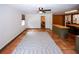 Spacious living room features terracotta flooring, an area rug, and natural light at 2202 Springdale Dr, Snellville, GA 30078