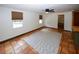 Spacious living room with terracotta floors, a ceiling fan, and large windows at 2202 Springdale Dr, Snellville, GA 30078