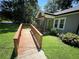 Accessible front entrance with wooden ramp and inviting green door at 1482 Whitfield Se St, Smyrna, GA 30080