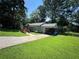 Inviting single-story home with a well-maintained lawn and a long driveway at 1482 Whitfield Se St, Smyrna, GA 30080