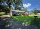 Well-kept home featuring green lawn, mature trees, and convenient access at 1482 Whitfield Se St, Smyrna, GA 30080
