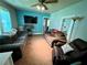 Cozy living room featuring two sofas, a ceiling fan and a large TV at 1482 Whitfield Se St, Smyrna, GA 30080