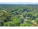 An aerial view showing lush green trees surrounding a neighborhood at 1655 Oak Crest Ct, Marietta, GA 30066