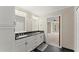 Elegant bathroom with double sinks, granite countertop, and white cabinets with brushed metal hardware at 1655 Oak Crest Ct, Marietta, GA 30066