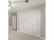 Bedroom features neutral walls, soft carpet, closet, and ceiling fan for added comfort and appeal at 1655 Oak Crest Ct, Marietta, GA 30066
