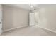 Inviting bedroom boasting neutral walls, carpet flooring, and an open doorway leading to another area at 1655 Oak Crest Ct, Marietta, GA 30066