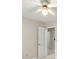 Cozy bedroom offering neutral walls, carpet, ceiling fan, and doorway entrance into an adjacent room at 1655 Oak Crest Ct, Marietta, GA 30066