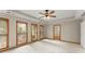 Comfortable bedroom with plush carpet, ceiling fan, and lots of windows with natural light at 1655 Oak Crest Ct, Marietta, GA 30066