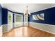 Dining room featuring hardwood floors, large windows with natural light, and stylish chandelier at 1655 Oak Crest Ct, Marietta, GA 30066